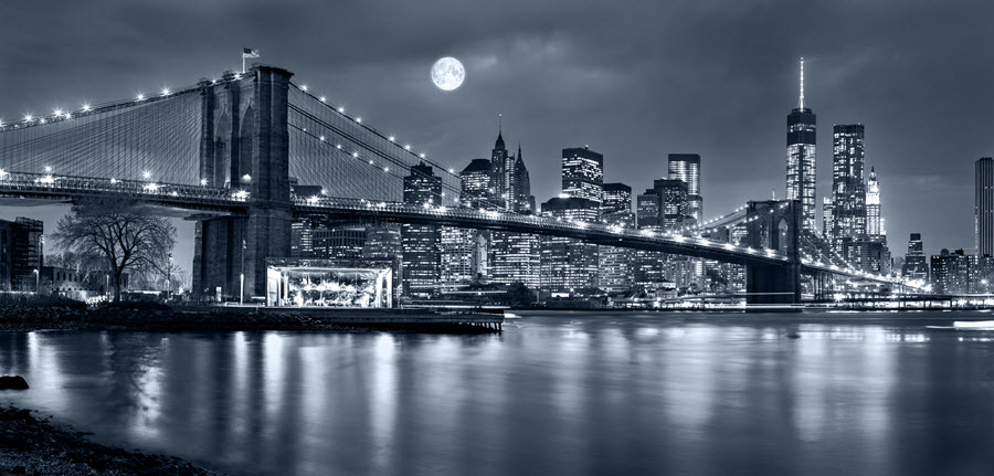 Black & White Photo of Full Moon Over Manhattan.