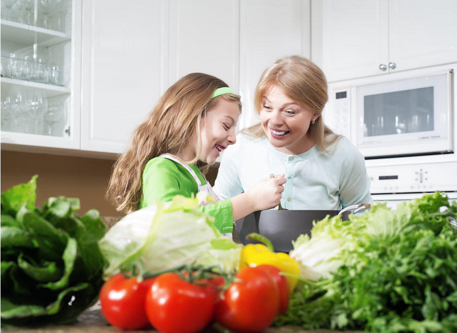 Girl Cooking in Kitchen.